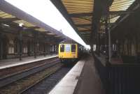 A DMU boarding at Warrington Central in August 1988.<br><br>[Ian Dinmore /08/1988]