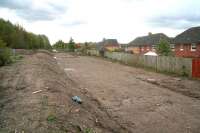 Preparations at the site of the future Newtongrange station, looking south towards Gorebridge on 19 October 2011. The gardens of Jenks Loan, one of a number of modern developments in the area, run alongside the formation on the right, with the A7 behind the camera. The original Newtongrange station stood on the other (north) side of the A7 road bridge. [See image 24342] <br>
<br><br>[John Furnevel 19/10/2011]