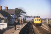 A southbound DMU, bound for Machynlleth, stands at Harlech in 1986.<br><br>[Ian Dinmore /03/1986]
