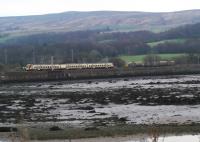 'Leaf Train' waiting in Craigendoran Loop is passed by a SPT train heading for Helensburgh.<br><br>[Beth Crawford 19/11/2011]