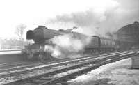 A3 no 60039 <I>Sandwich</I> with an up ECML express about to depart from Darlington on a winter's day in 1962.<br><br>[K A Gray //1962]