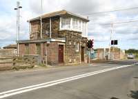 The ECML level crossing and signal box at Chathill, Northumberland, photographed looking east towards the coast in August 2007. [See image 21832] <br><br>[John Furnevel 16/08/2007]