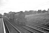 Platform view south along the Waverley route from St Boswells on 10 September 1962. St Margarets B1 no 61244 <I>Strang Steel</I> is about to run through the station heading north with a brake van.<br><br>[R Sillitto/A Renfrew Collection (Courtesy Bruce McCartney) 10/09/1962]
