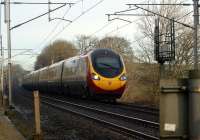 A southbound Pendolino rushes towards Carnforth past Yealand Steps on 28 January 2012.<br><br>[John McIntyre 28/01/2012]