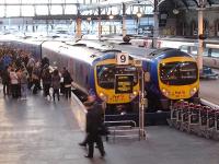 Consecutively numbered TransPennine Express DMU's 185111 & 185112 stand in adjacent bays 9 & 10 at Newcastle Central station on 8 February with a large number of passengers awaiting access to the 16.15 service to Manchester Airport.<br><br>[David Pesterfield 08/02/2012]