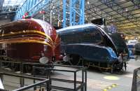 The recent rebuild of 6229 <I>Duchess of Hamilton</I> with new streamlined casing has been well documented but is almost breathtaking when first seen at the NRM. The LMS Pacific is sited alongside its LNER A4 rival and is displayed with an LMS coach, also in red with gold stripes. The UK preservation movement is achieving things that would have been unthinkable a few years ago.<br><br>[Mark Bartlett 02/02/2012]