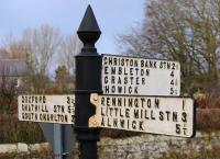 On each of the 3 Arms of this still well-maintained Northumberland road sign, set at bearings of 0, 90, and 180 degrees., the traveller is directed to an ECML station. An intending passenger may well be somewhat dissappointed - Chathill Station., two trains per day. Christon Bank Station., closed to passengers 1958, closed completely 1965, converted station building and goods shed remain [see image 21787]. Little Mill Station., closed to passengers 1958, closed completely 1965, long demolished!<br><br>[Brian Taylor /02/2012]
