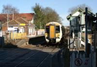 A Southeastern service from Ramsgate to London Charing Cross via Ashford passes the down platform and signalbox at Sturry, near Canterbury, on 23 February 2012. The train is about to call at the up platform on this side of the level crossing.<br><br>[John McIntyre 23/02/2012]
