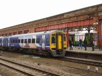Northern Rail 158903 calls at Wakefield Kirkgate on 2 March with the 15.23 service to Nottingham ex-Leeds. Meantime, in the background, Centro liveried 150119 - with Northern logos and a hidden Northern liveried 153 attached - waits at Platform 3 to form the 15.31 to Knottingley.<br><br>[David Pesterfield 02/03/2012]