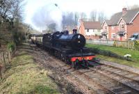 Former Somerset & Dorset 2-8-0 No 88 arriving at Crowcombe Heathfield Station on 11 March 2012.<br><br>[Peter Todd 11/03/2012]