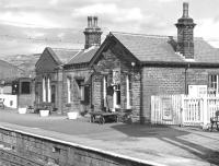 The paint brush is out at Oxenhope on 28 March 1976, all part of getting the station spick and span for Easter, which is only a few weeks away. <br><br>[Bill Jamieson 28/03/1976]