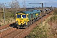 Freightliner 66544 approaches the former Camps Junction with a Leith - Killoch loaded coal train on 31 March 2012. [See image 25874]<br><br>[Bill Roberton 31/03/2012]