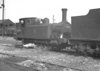 Class J88 0-6-0 no 68349 stands amongst the ashes at Eastfield shed in the late 1950s. The locomotive is recorded as being officially withdrawn from Grangemouth in November 1959.<br><br>[K A Gray //]