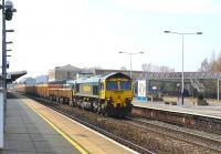 A Westbury - Mount Sorrel ballast train heads east through Swindon on 22 March behind Freightliner 66602.<br><br>[Peter Todd 22/03/2012]