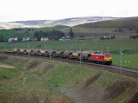 Northbound Carlisle Yard to Mossend Yard freight approaches Abington. (Plus lots of sheep with very cute lambs!)<br><br>[Beth Crawford 30/04/2012]