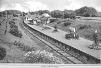 Old postcard showing the station at Alloway. View is to the east from just by the tunnel - probably from the footbridge (which collapsed in 1948 under the weight of the passengers on the Troon Old Parish Church Sunday School Trip). The station cottages can be seen on the right - their address is still Station Cottages. The high level goods yard is now the site of the new Burns Heritage Museum.<br><br>[Colin Miller Collection //]