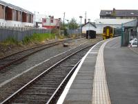 158829 starts its 35 minute lay over at Pwllheli on 9 May before forming the 13.38 to Birmingham International. The overnight servicing siding is to the left <br><br>[David Pesterfield 09/05/2012]
