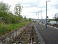 Tram type sleepers with tie bars seen on the still active line in the former west end bay at Newtown in May 2012. In the background the 12.04 departure to Aberystwyth & Pwllheli has just left the station.<br><br>[David Pesterfield 08/05/2012]