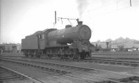 View south west over Eastfield shed yard in the 1960s with J38 0-6-0 no 65911 featured. The short section of catenary beyond the locomotive is part of a mock up used for staff training and familiarisation purposes. <br><br>[K A Gray //]