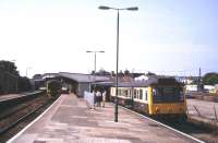 Platform scene at St Erth in August 1995. A Penzance - Plymouth service stands at the main line platform with the St Ives branch train in the bay.<br><br>[Ian Dinmore /08/1995]