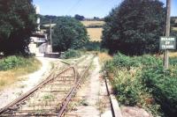 Entrance to the clay dries at Moorswater, Cornwall, in August 1989. View is north, with Coombe Junction behind the camera [see image 17767]. Running straight ahead is the stub of a line which once served a number of mines and quarries in the surrounding area. This line closed to all traffic in 1916. <br><br>[Ian Dinmore /08/1989]