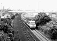 The down <I>'Aberdonian'</I> InterCity HST continues its journey north following the Dundee stop on 5 August 1981. The train is seen here shortly after passing Camperdown Junction with the dock estate to the left and the A92 road running parallel with the line on the right.<br><br>[John Furnevel 05/08/1981]