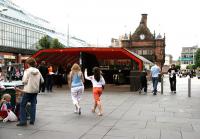 The new 'modern' entrance to St Enoch Subway on a Saturday in July 2005 with the original 1896 building standing directly behind. To the left is the St Enoch Centre, built on the site of the great main line station which closed in 1966. [See image 50452]<br><br>[John Furnevel 02/07/2005]