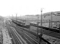 View south east at Tinsley in May 1980 with 41A MPD in its elevated position top right. The depot opened in 1964 when it took over activities previously undertaken at Grimesthorpe, Darnall, Canklow and Millhouses. At its peak it had an allocation of over 200 locomotives. [See image 42626]<br><br>[John Furnevel 06/05/1980]