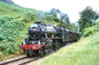 Black 5 No44767 <i>George Stephenson</i> storms up the gradient to Glenfinnan with <i>The Royal Scotsman</i> from Fort William in July 1994.<br><br>[John Gray /07/1994]