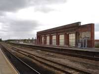 Retained section of the former overall roof support wall that ran along island platforms 2 & 3 at Wakefield Kirkgate, with new subway canopy supports in place alongside platform 2. [See image 40060]<br><br>[David Pesterfield 26/08/2012]