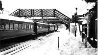 Old photograph, thought to have been taken in the late 1940s, showing a winter scene at Town Green station, Aughton, Lancs. Nowadays this station is part of the Ormskirk branch of Merseyrail's Northern Line. [See image 19649]<br><br>[John McIntyre Collection //]