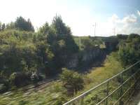 View of the goods line that starts at Cadoxton Station and runs parallel to the passenger line almost to Barry Docks station where it drops down and turns under Ffordd Y Mileniwm to reach the Barry Docks' industrial complex. <br><br>[David Pesterfield 19/09/2012]