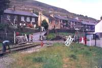 Track lifting underway at Six Bells Crossing, Blaina, between Abertillery and Brynmawr, in 1977. This section of the line, running north to the site of Coalbrookvale Iron Works, had closed 4 years earlier. <br><br>[Ian Dinmore //1977]