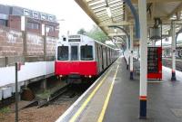 View from the station concourse over the platform 7 buffer stops at Richmond on 22 July 2005, with a District Line train for Upminster awaiting its departure time.<br><br>[John Furnevel 22/07/2005]