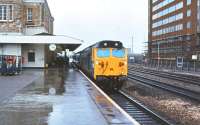50036 <I>'Victorious'</I> with a train at a wet Swindon station in July 1980.<br><br>[Peter Todd 06/07/1980]