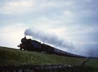 A double-headed passenger train ascending Shap in fading light during the 1960s. The leading loco will almost certainly be a Grayrigg banker attached as pilot at Oxenholme and which will come off the train at Shap Summit.<br><br>[Robin Barbour Collection (Courtesy Bruce McCartney) //]