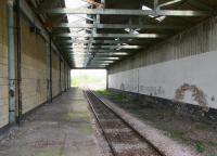 The overall roof over a section of the through platform at North Road, Darlington in April 2009 looking west towards Bishop Auckland. Trains no longer stop under the roof but use the eastern end of the platform nearest the McNay Street entrance. It does however appear to be much appreciated by the local pigeons. [See image 30877]<br><br>[John Furnevel 24/04/2009]