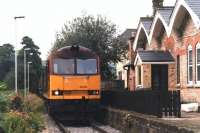 EWS 60001 waits by the former Coxbench station, Derbyshire (closed June 1930) for the crossing gates to be opened before heading up the Denby freight branch to the opencast loading point in July 1997. The mothballed branch was finally lifted during 2012.<br><br>[David Pesterfield 15/07/1997]