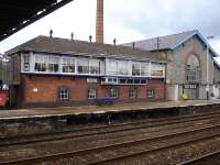 Totnes Station's long former signal box building sited behind the up platform and accessed from the footbridge steps half landing is now used as a cafe. Other than the cafe signs as a giveaway it could be taken for an operational box <br><br>[David Pesterfield 15/01/2013]