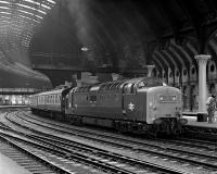 The soaring train sheds of the Victorian era had the practical feature of not trapping smoke at platform level - something which also proved useful during the Deltic era! No. 55001 'St Paddy' arrives at York with the Sunday 09.50 Kings Cross to Edinburgh on 4 July 1976, a dated train hence the use of Mk 1 stock.<br><br>[Bill Jamieson 04/07/1976]