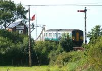 A DMU about to cross Somerleyton swing bridge in September 2004 on its way from Lowestoft to Norwich.<br><br>[Ian Dinmore 08/09/2004]
