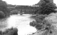 A 'Peak' takes the down <I>Thames Clyde Express</I> across the 1850 Martinton Bridge over the River Nith shortly after leaving Dumfries in the spring of 1971.<br><br>[John Furnevel 08/04/1971]