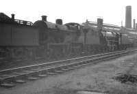 Fowler 2P 4-4-0 no 40585 languishes in the sidings alongside Nottingham shed (16A) in May 1961, some 3 months after official withdrawal by BR.<br><br>[K A Gray 13/05/1961]