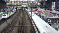 Looking over the main platforms at Hamburg in July 2010. On the left a Metronom train awaits its departure time, in the centre of the photograph an ICE service snakes away westwards, while to the right two DB trains are departing in opposite directions.<br><br>[John Steven 27/07/2010]