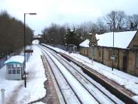 A near 150mm layer of snow has almost engulfed Ruabon Station. View north towards Wrexham from the station footbridge on 27 March 2013.<br><br>[David Pesterfield 27/03/2013]