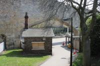 Alongside York's city walls, and the pedestrian entrance to George Stephenson House (Network Rail HQ), is this unmistakable former railway hut. The arch in the background was created so that trains could pass through the wall to the original Y&NM terminus, later replaced by York's present day through station.<br><br>[Mark Bartlett 20/04/2013]