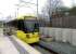 A Manchester Metrolink tram arriving at St Werburghs Road on 23 April 2013. Opened in July 2011, the tram stop is built on the former CLC route which closed to passengers in 1967. Much of the structure stands on an area formerly occupied by Chorlton Junction signal box.<br><br>[John Yellowlees 23/04/2013]