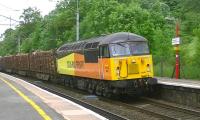 Colas Railfreight 56087 heads south through Oxenholme on 15 June with a Carlisle Yard to Chirk Kronospan log train.<br><br>[Ken Browne 15/06/2013]
