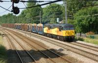 Colas Rail Freight 56105+56087 head south on the WCML at Euxton on 6 July with the Carlisle to Chirk loaded log train.<br><br>[John McIntyre 06/07/2013]