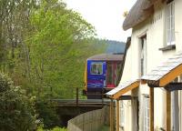 A Class 143 passes Collerton Mill near Kings Nympton on the Tarka Line in April 2011.<br><br>[Ian Dinmore 22/04/2011]